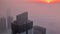 Rare early morning winter fog above the Dubai Marina skyline and skyscrapers lighted by sun aerial timelapse.