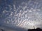 A rare handsome view of a pattern of white clouds with golden sun rays in blue sky