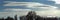 Rare lenticular stratocumulus clouds crossing winter sky