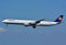 Rare Lufthansa Airbus A340 Big jumbo jet airplane in blue sky