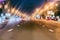 Rare night cars. Abstract blurred colorful background of urban street night traffic with bokeh lights, city street