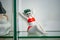 Rare porcelain figurine on glass shelf. Girl in swimsuit