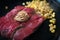 A rare steak on a sizzling hot plate with corn kernels as garnish