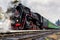 Rare steam train locomotive on the railway station