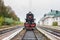 Rare steam train locomotive at the small railway station