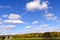 Rare white clouds in the blue autumn sky