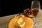 Rare, wood, round plate of wedge of cheese, knife and glass of red wine