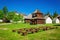 Rare wooden bell tower with folk houses Slovakia