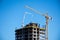 Ras al Khaimah building development building high rise hotel or apartment building complex with cranes and concrete on a beautiful