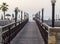 Ras Al Khaimah, UAE - 04.04.2022 - Wooden bridge leading to the beach at The Cove Rotana Resort. Holiday