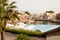 Ras Al Khaimah, UAE - April 2022 - View of the pool and private villas at Cove Rotana Resort