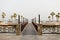 Ras Al Khaimah, UAE - April 2022 - Wooden bridge leading to the beach at Cove Rotana Resort