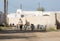 Ras Al Khaimah, United Arab Emirates, 2/02/18/2016, An arab man shepherds his goats through and abandoned village in the UAE