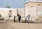 Ras Al Khaimah, United Arab Emirates, 2/02/18/2016, An arab man shepherds his goats through and abandoned village in the UAE