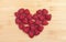Raspberries Arranged In Heart Shape On Table