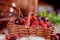 Raspberries and blueberries in basket with sweet cherry Summer and healthy food selective focus