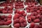 Raspberries in containers on a stall forming a background