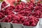 Raspberries on a farm market in the city. Fruits and vegetables at a farmers market