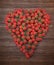 Raspberries and strawberries forming a heart shape