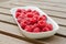 Raspberries on a white plate.