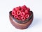 Raspberries in a wooden bowl