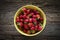 Raspberries in a yellow jar.