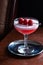 Raspberry Clover Club Cocktail in Dark Bar