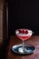 Raspberry Clover Club Cocktail Drink in Dark Luxurious Bar