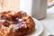 Raspberry danish pastry with a mug