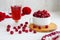 raspberry drink on a gray stone background, walls, glass cup with compote, fresh raspberries on a wooden table, cooling