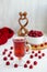 raspberry drink on a white table background, walls, glass cup with compote, fresh raspberries on a wooden table, cooling