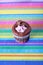 Raspberry filled cupcake on colorful background
