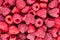 Raspberry food background, top view. Red sweet raspberries