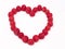 Raspberry heart. The figure of the heart is lined with ripe raspberry berries on a white background.