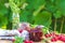 Raspberry Jam And Fresh Raspberry On A Rustic Wooden Table Outdoors