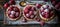 Raspberry mini tart on white cutting board with vintage teaspoons from above view