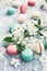 Raspberry, minty and vanilla macaroons and white flowers
