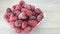 Raspberry ripe frozen in a glass bowl