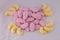 Raspberry Shrimps & Bananas delicious retro British candy sweets in funky pattern on white.