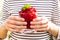 Raspberry sorbet in girl`s hands - summer refreshing dessert