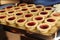 Raspberry tarts on a tray