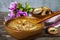 Rassolnik soup in a wooden plate and bagels