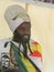 Rastafarian man with Zimbabwean flag.