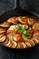 Ratatouille Vegetable Stew with zucchini, eggplants, tomatoes, garlic, onion and basil. on cast iron pan. Traditional