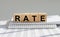 RATE word on wooden cube blocks on office table