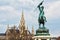 Rathaus tower against Erzherzog Karl Statue and a cloudy sky, Wien