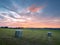 Ratingen, Germany - Beautiful sunset in the Bergisches Land region. Meadow in straw bales. Rural landscape