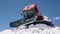 Ratrak, snow cat, snow tractor used for preparing ski slopes and trails. Russia, Elbrus Region - May 14, 2021