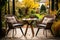 Rattan garden table and chairs set for two people on autumn garden background