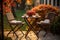 Rattan garden table and chairs set for two people on autumn garden background